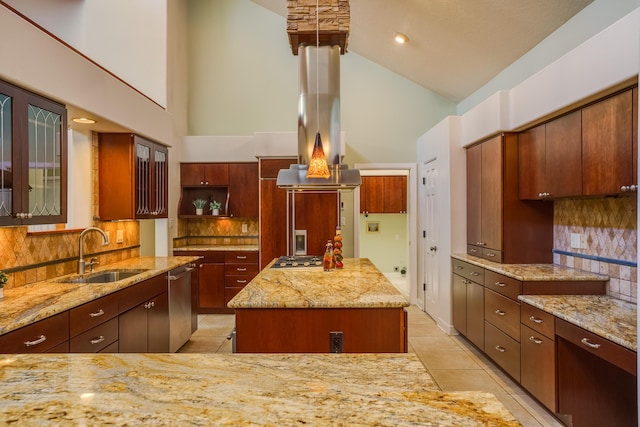 kitchen with light stone counters, light tile patterned floors, island exhaust hood, stainless steel appliances, and a sink