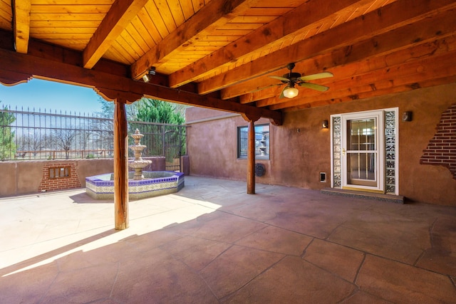 view of patio / terrace featuring a ceiling fan and fence