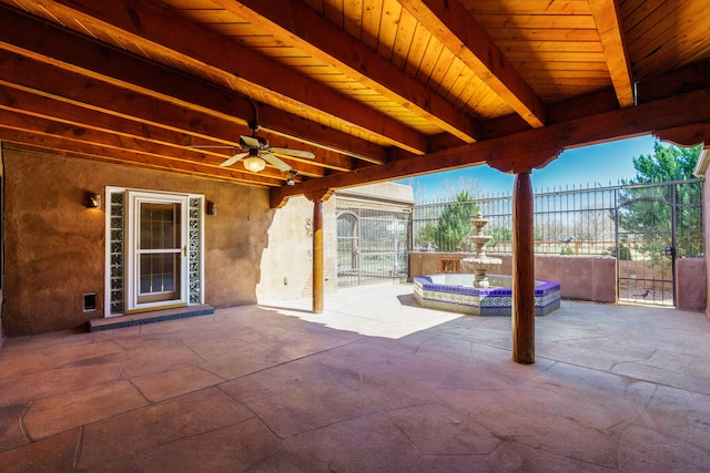 view of patio with a gate, fence, and ceiling fan