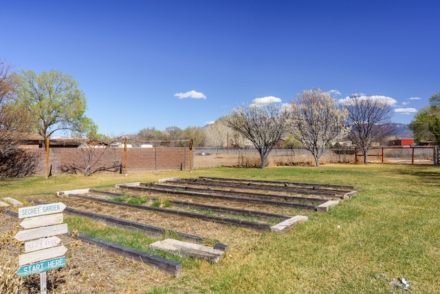 view of yard featuring a rural view and fence