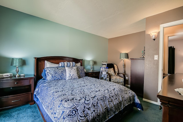 carpeted bedroom featuring baseboards