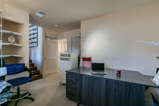 office with light carpet and visible vents