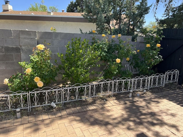 view of patio / terrace featuring fence