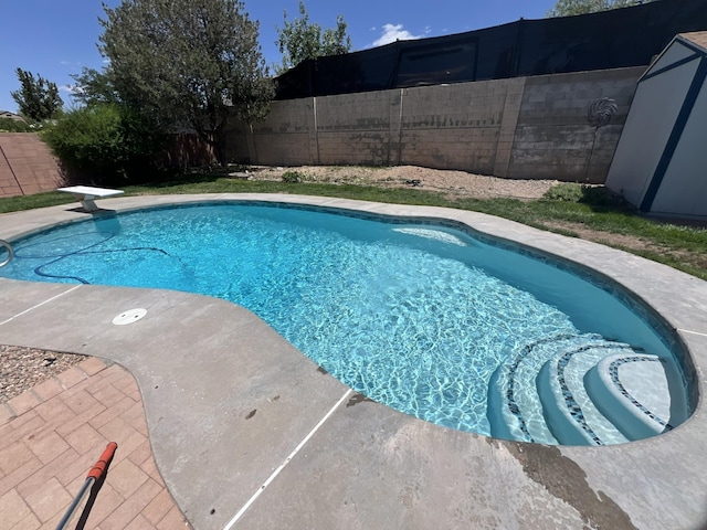 view of swimming pool with a fenced backyard and a fenced in pool