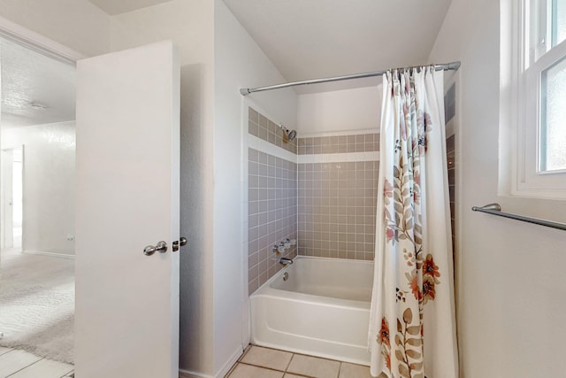 full bathroom featuring tile patterned flooring and shower / tub combo with curtain