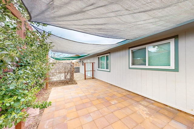 view of patio / terrace featuring fence