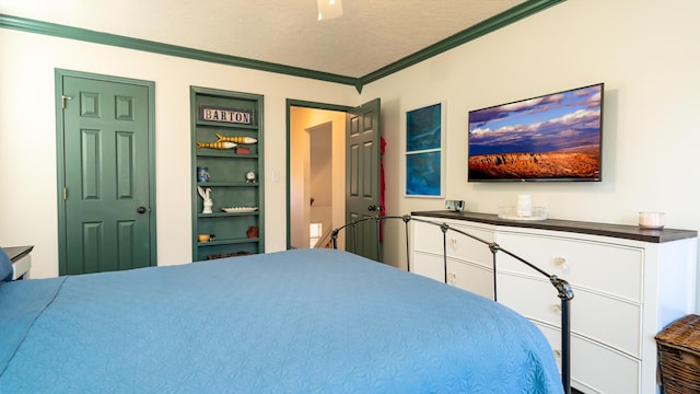 bedroom with a textured ceiling, ceiling fan, and ornamental molding