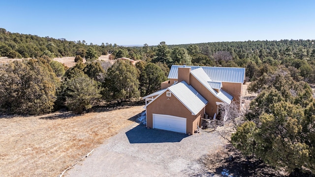 drone / aerial view with a view of trees