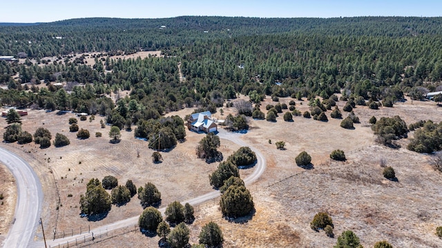 aerial view featuring a wooded view