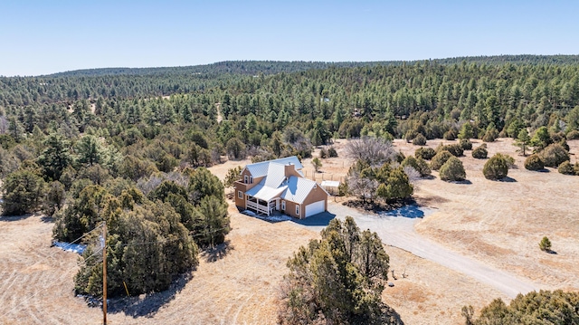 bird's eye view featuring a forest view