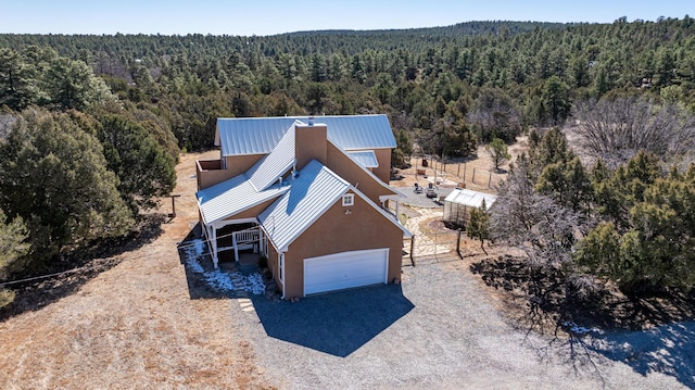 aerial view featuring a view of trees