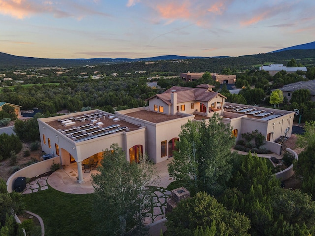 aerial view at dusk with a mountain view