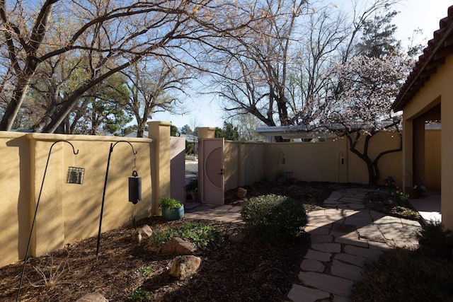 view of yard featuring a gate and fence