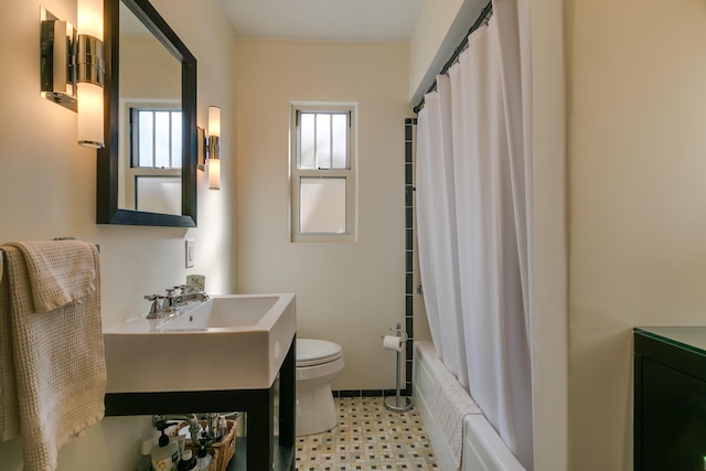 bathroom with tile patterned floors, shower / bath combination with curtain, toilet, and vanity