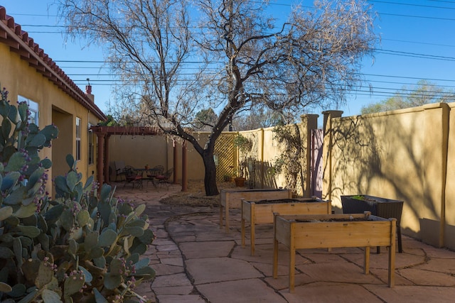 view of patio with outdoor dining area and a fenced backyard