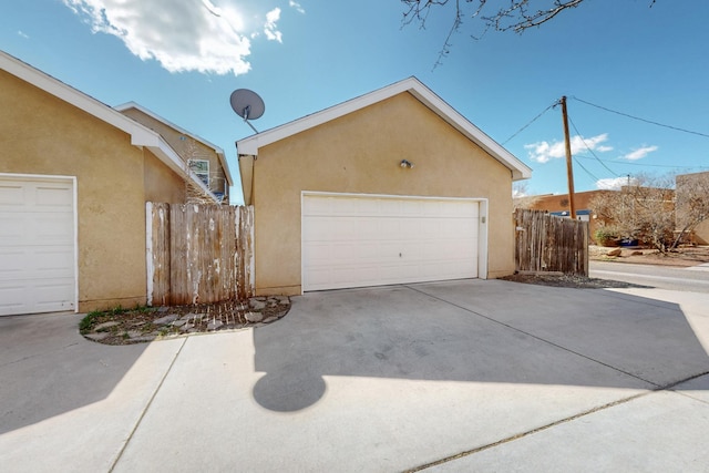 garage featuring fence