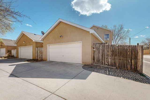 view of front of property with stucco siding and fence