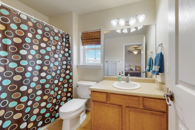 ensuite bathroom featuring vanity, toilet, a shower with curtain, and ensuite bathroom