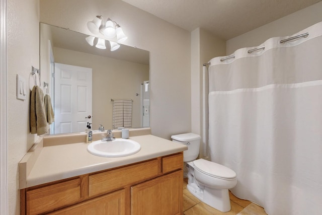 full bathroom with vanity, tile patterned floors, toilet, and a shower with curtain