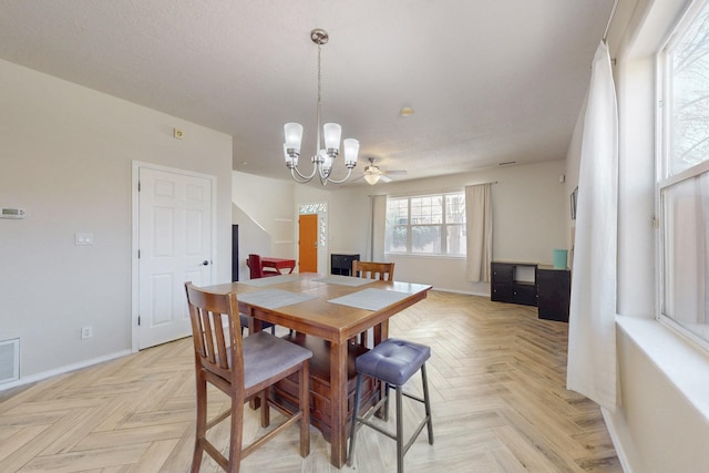 dining area with visible vents, baseboards, and a chandelier