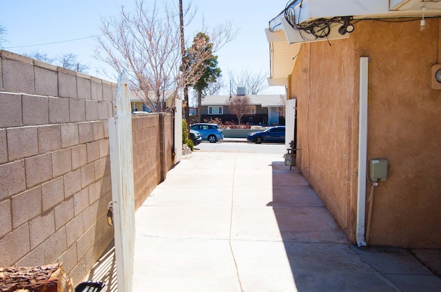 view of property exterior featuring fence and stucco siding