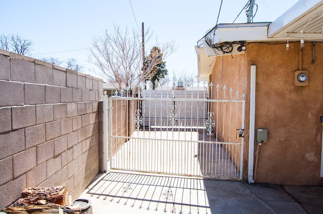 view of gate featuring fence