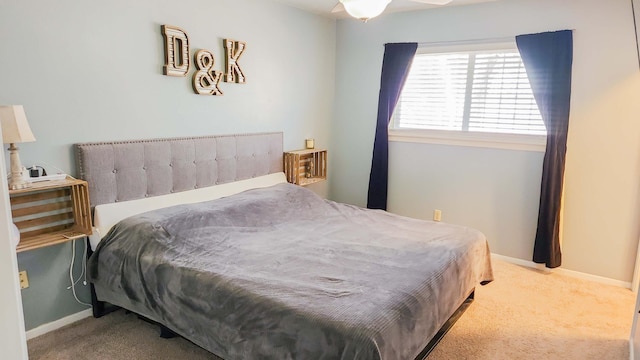 bedroom featuring baseboards and carpet flooring