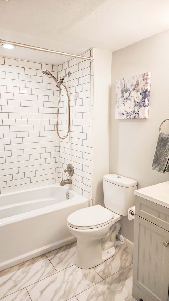 full bathroom with vanity, shower / bathing tub combination, toilet, and marble finish floor