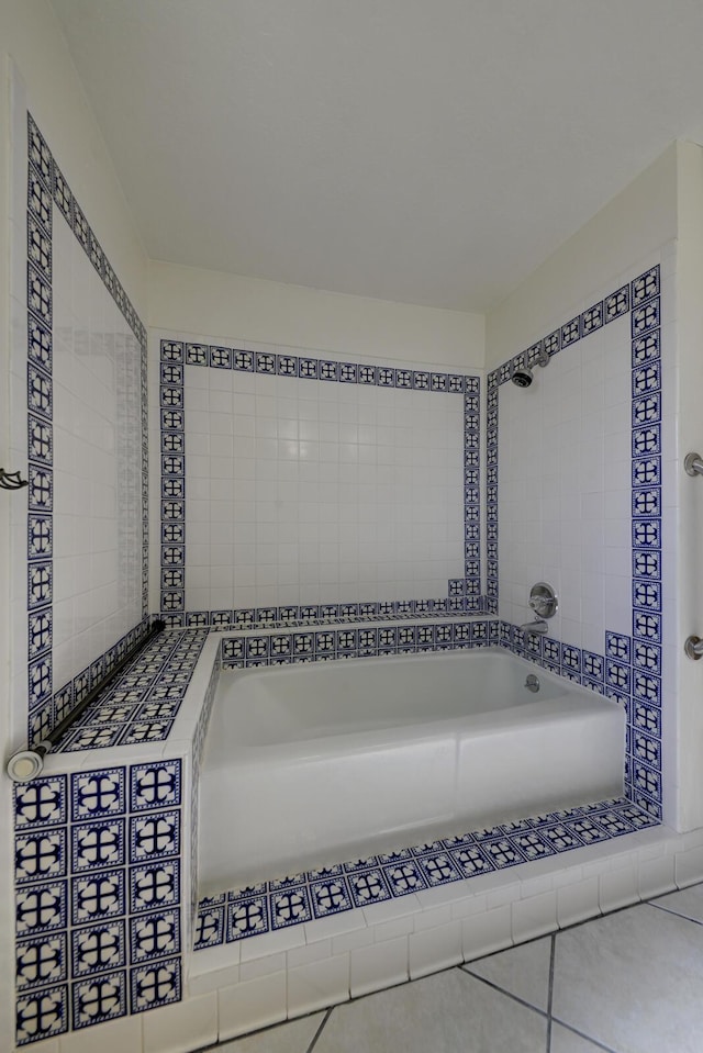 full bath featuring tile patterned floors and a washtub