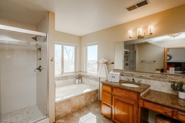 bathroom featuring visible vents, a garden tub, a stall shower, decorative backsplash, and vanity