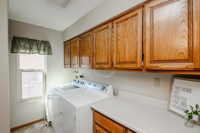 laundry area with washer and clothes dryer, cabinet space, and baseboards