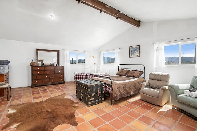 bedroom featuring light tile patterned flooring and lofted ceiling with beams