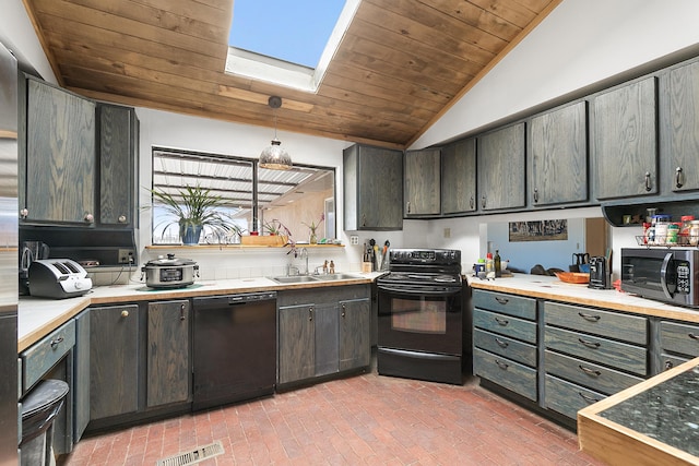 kitchen featuring visible vents, vaulted ceiling with skylight, a sink, black appliances, and wooden ceiling