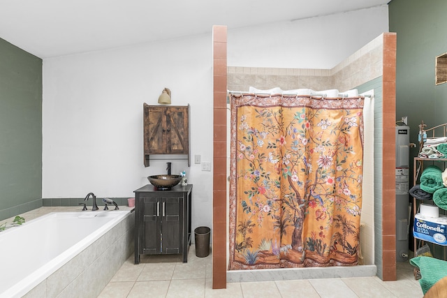 bathroom with a sink, tiled shower, a garden tub, and tile patterned flooring