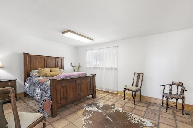 bedroom featuring baseboards