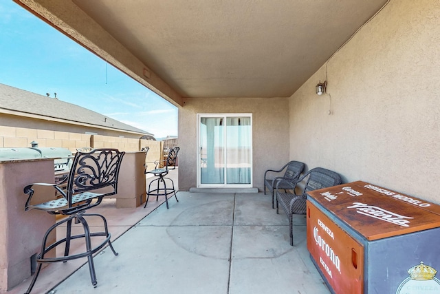 view of patio featuring fence