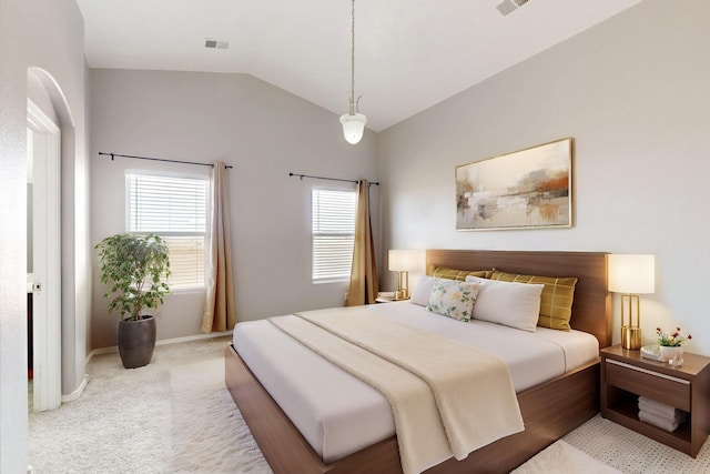 carpeted bedroom with visible vents, baseboards, and vaulted ceiling