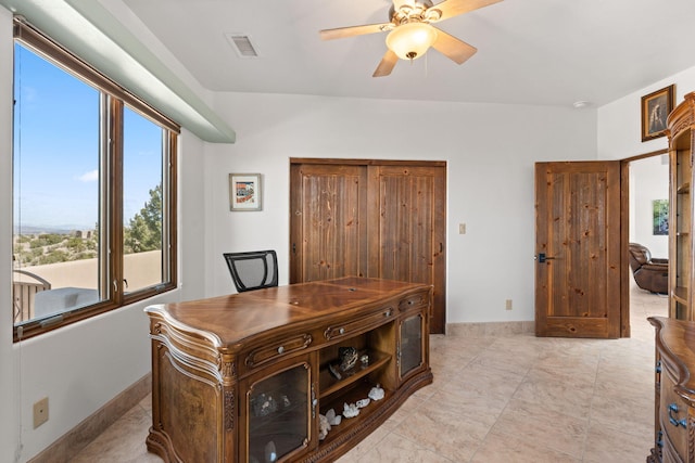 office space with visible vents and ceiling fan