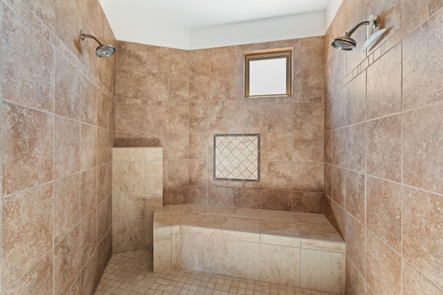 bathroom featuring a tile shower