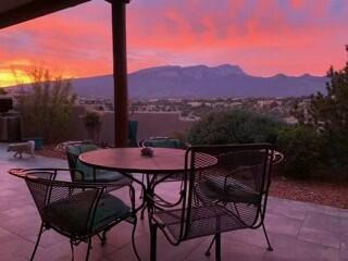 view of patio / terrace featuring a mountain view and outdoor dining space