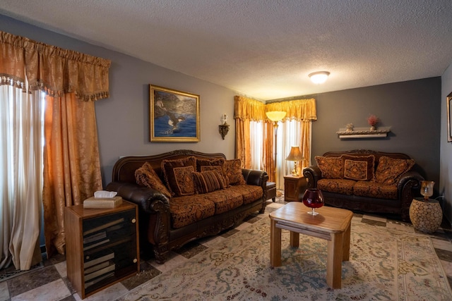 living area featuring a textured ceiling