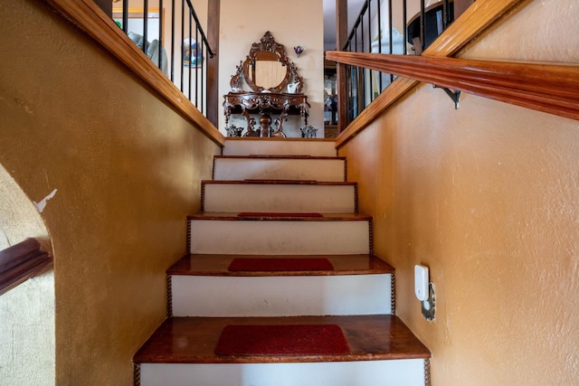 stairs with a textured wall