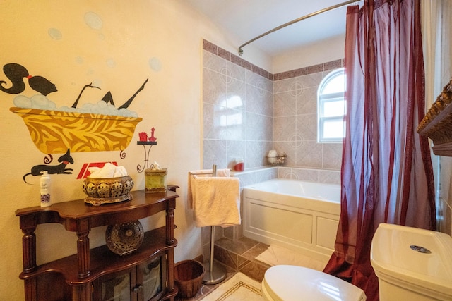 full bath featuring toilet, tile patterned flooring, and shower / bath combination with curtain