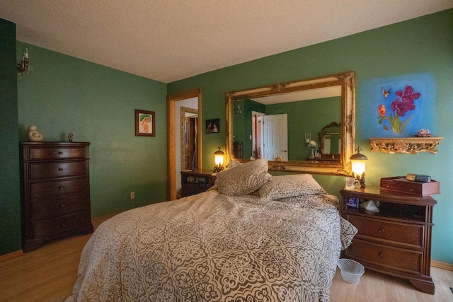 bedroom with wood finished floors