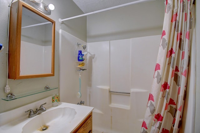 bathroom with a shower with curtain and vanity