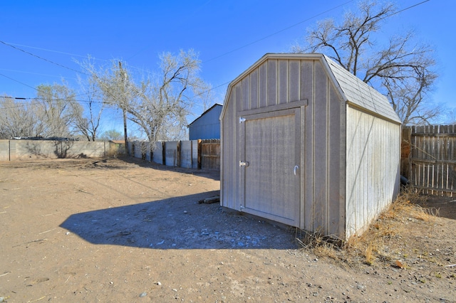 view of shed with a fenced backyard