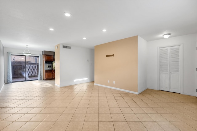 unfurnished room with light tile patterned floors, recessed lighting, visible vents, and baseboards