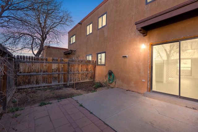 patio terrace at dusk with fence