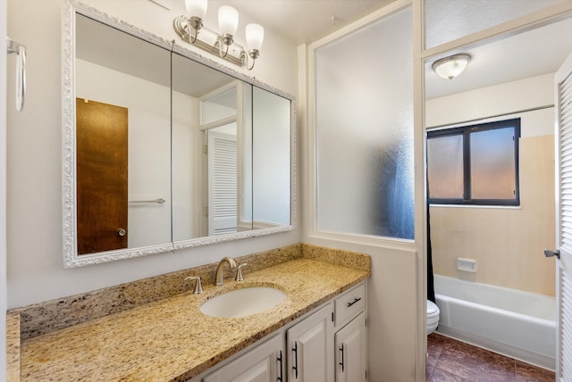 bathroom with toilet and vanity