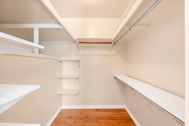 spacious closet with light wood-style floors